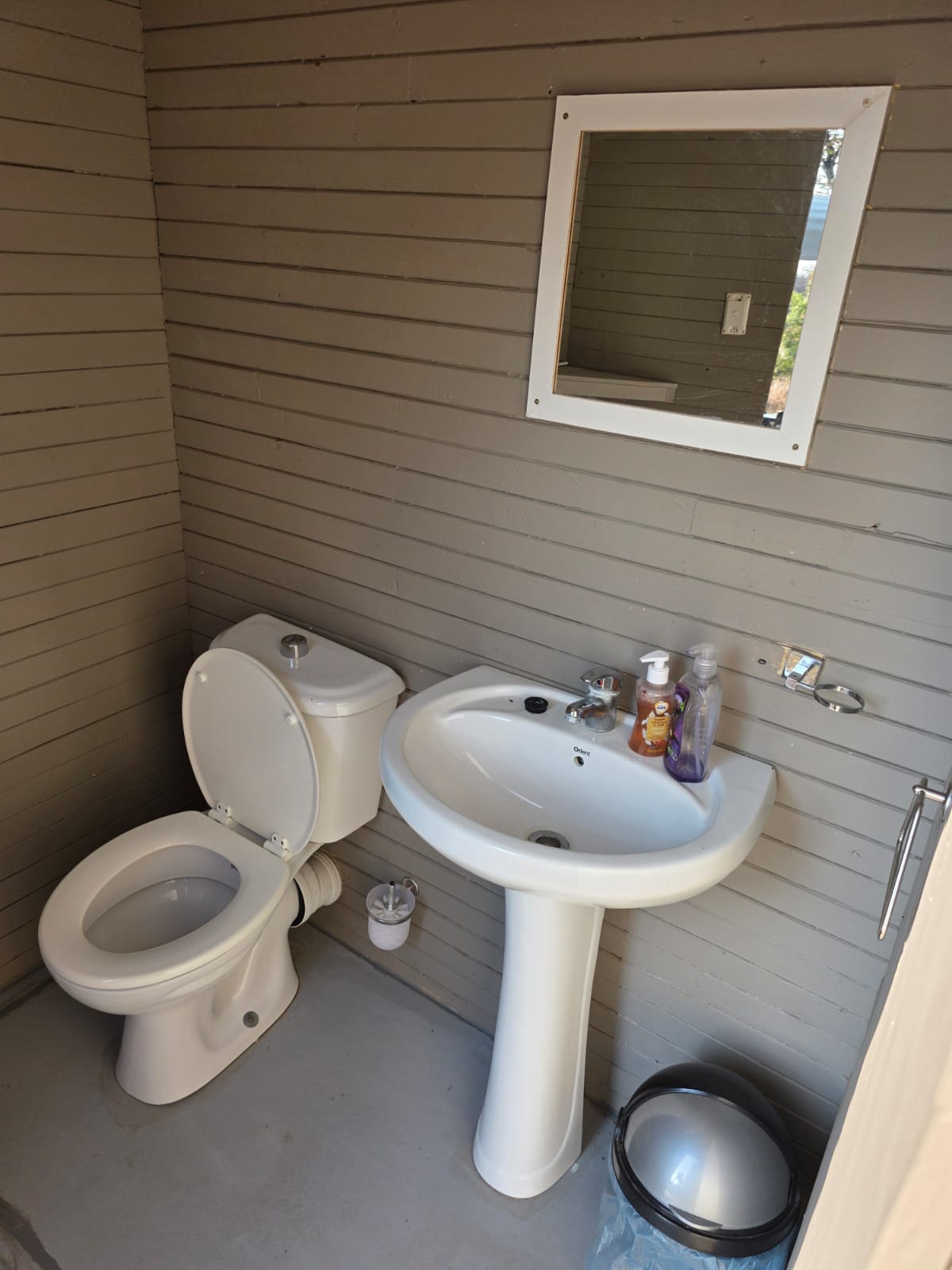 Basin and mirror inside the ablution block